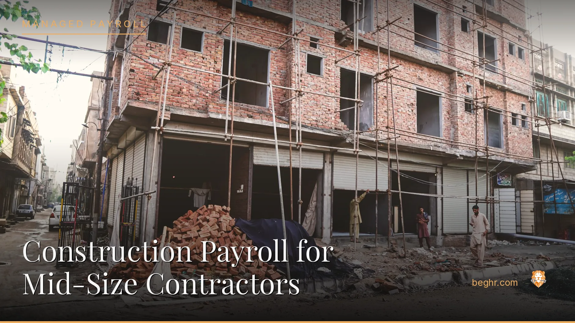 A real construction site, workers in hard hats and hi-vis vests reviewing plans