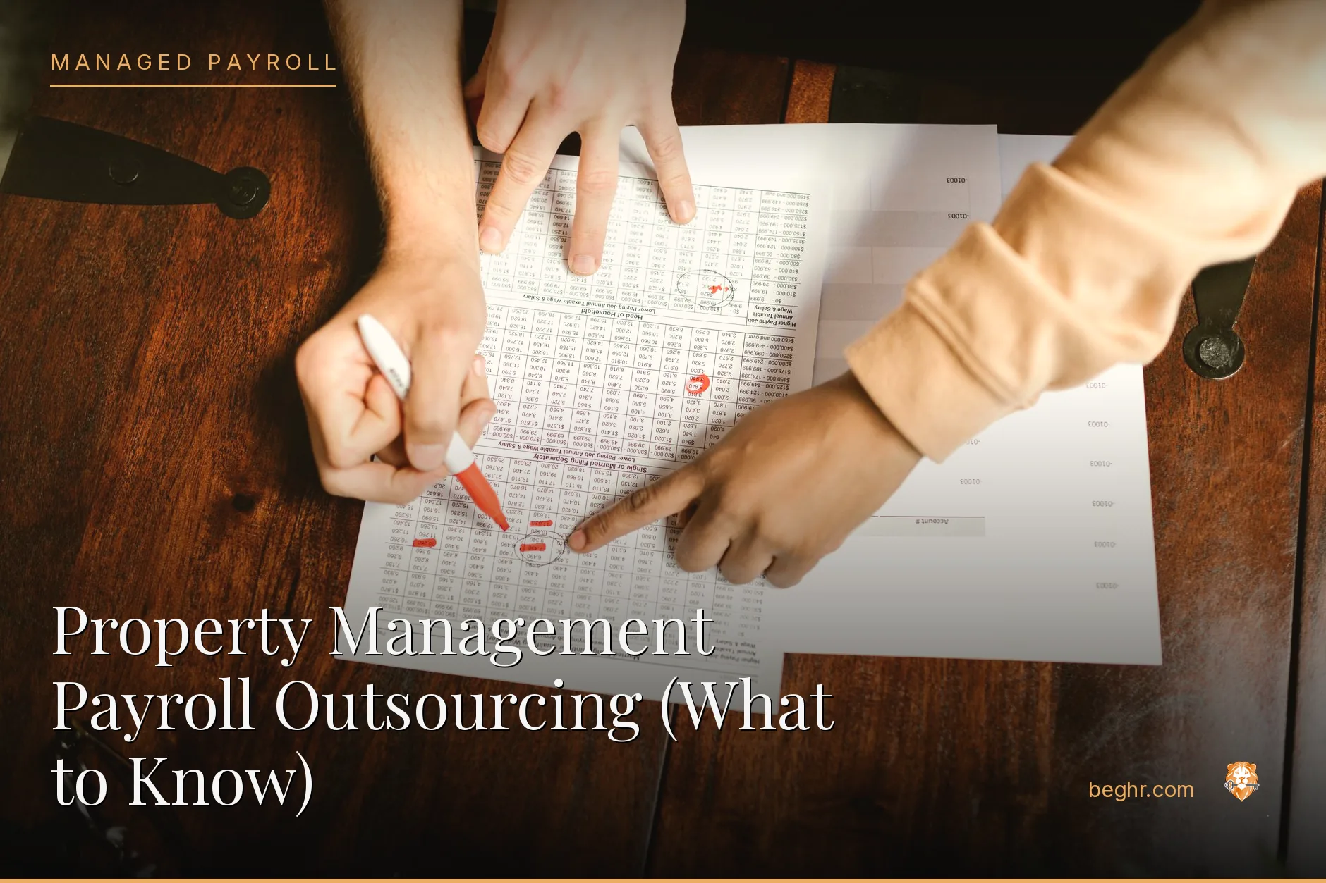 Business professionals reviewing payroll and HR documents in a bright modern office